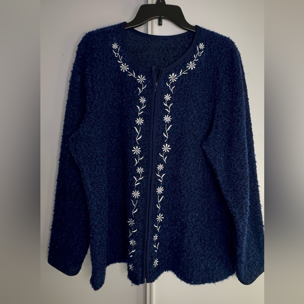 Blue zip up jacketed with floral design
